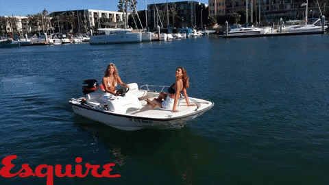 Girls Waving On A Boat GIF - EsquireMagazine Boat Yacht GIFs