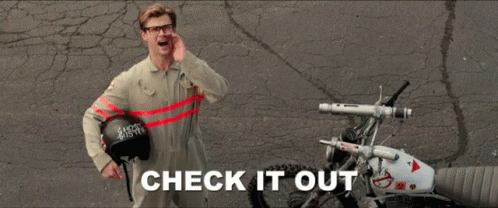 Gif of man saying "check it out" and pointing to the right. 