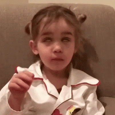 GIF of toddler with pigtails rolling her eyes