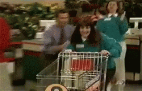 Woman runs with a shopping cart.