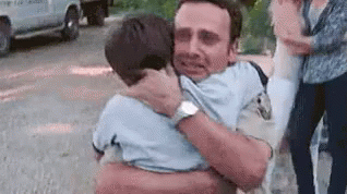 hugging his son the