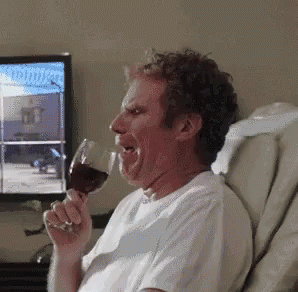 Gif of Will Ferrell crying and drinking a glass of wine