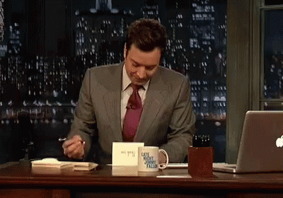 GIF with Jimmy Fallon writing on a card.