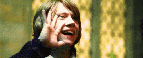 Character Ron Weasley from Harry Potter putting his hand up and awkwardly saying 