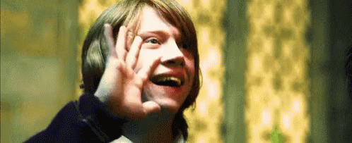 Character Ron Weasley from Harry Potter putting his hand up and awkwardly saying