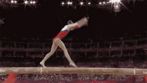 a flip on the balance beam gif gymnastics balancebeam flexile