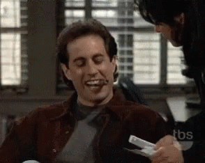 Jerry Seinfeld Laughing GIF - JerrySeinfeld Laughing Cigar GIFs