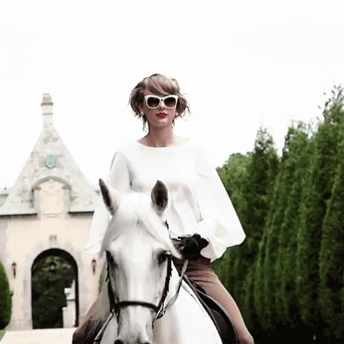 Taylor swift on a horse.
