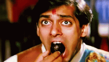 Image result for indian man eating sweets gif