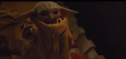 Image result for baby yoda looking at his hand gif