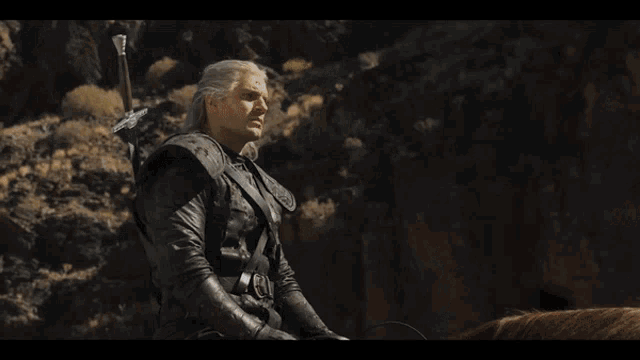 the Witcher riding a horse