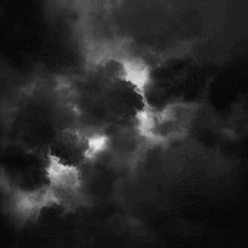 bat signal shining in the sky gif