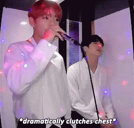 BTS V singing and Jin clutching chest dramatically gif
