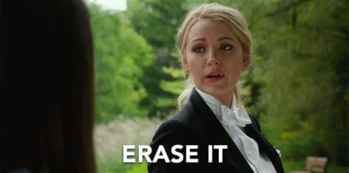 A blonde woman (Blake Lively) in a double-breasted jacket says "Erase it" - from A Simple Favor