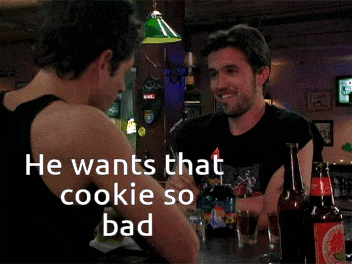 a man sitting at a bar with the words he wants that cookie so bad on the bottom
