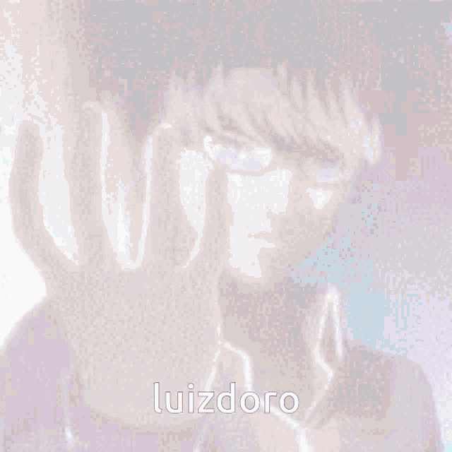 a pixelated image of a man with glasses and the name luizdoro at the bottom