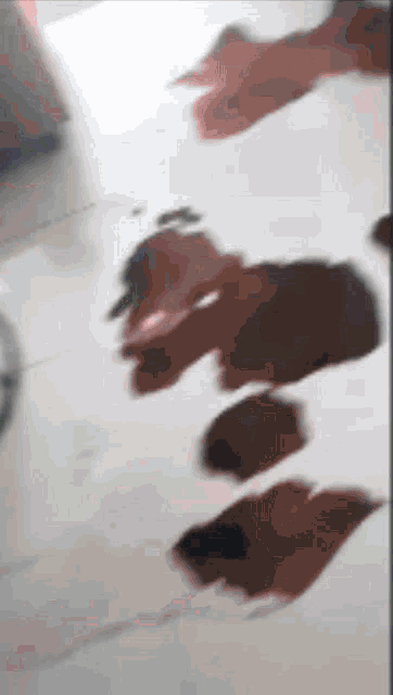a blurred image of a person 's footprints on the floor
