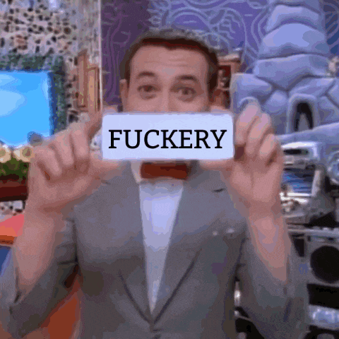 a man in a suit and bow tie is holding a sign that says fuckery