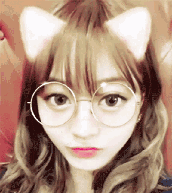 a girl with glasses and cat ears on her head
