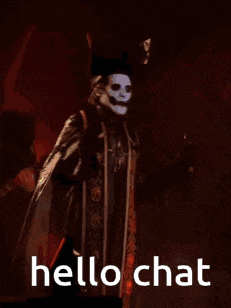 a man in a pirate costume with a mask on his face is holding a guitar and says hello chat