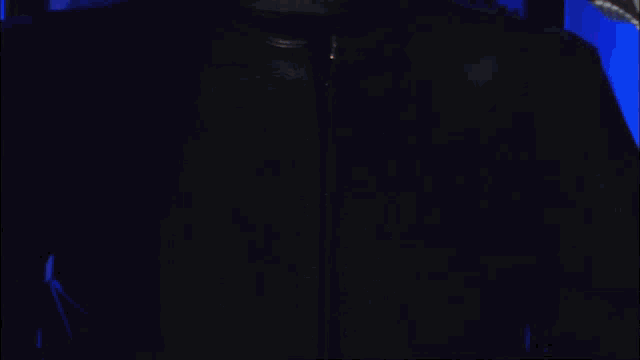 a man in a blue and yellow armor with a badge that says ' a ' on it