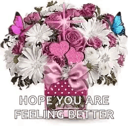 a bouquet of pink and white flowers with butterflies flying around it .