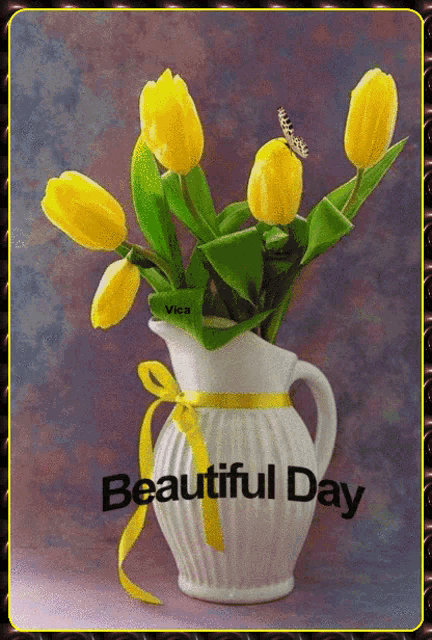 a picture of yellow tulips in a white vase with the words beautiful day below it