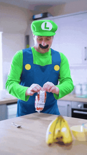 a man in a luigi costume is opening a bag