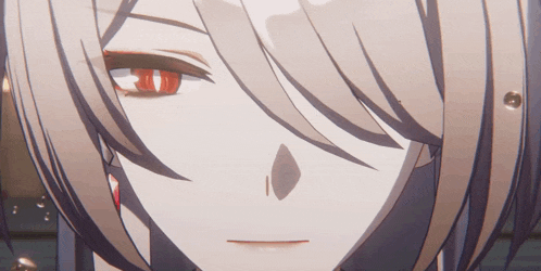 a close up of a girl 's face with red eyes
