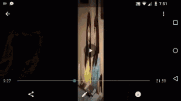 two women are sitting at a table with their mouths open in a video .