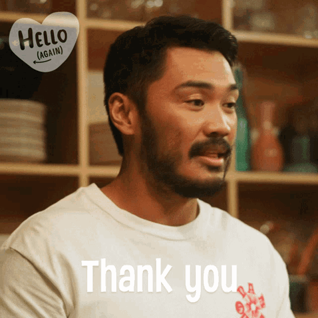 a man with a beard is wearing a shirt that says thank you