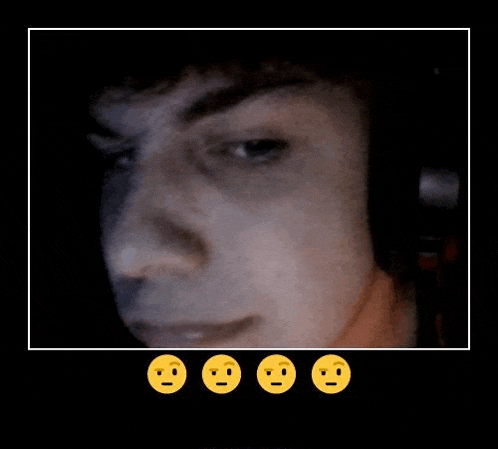 a close up of a man 's face with four yellow smiley faces .