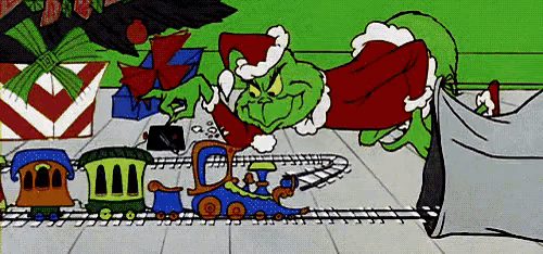 a cartoon of the grinch playing with a train set