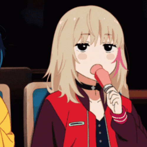 a girl in a red jacket is licking a pink object