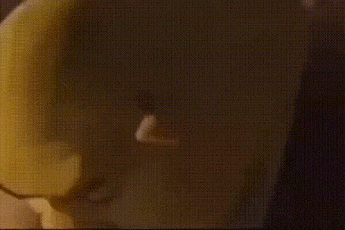 a close up of a person 's face with a yellow mask .