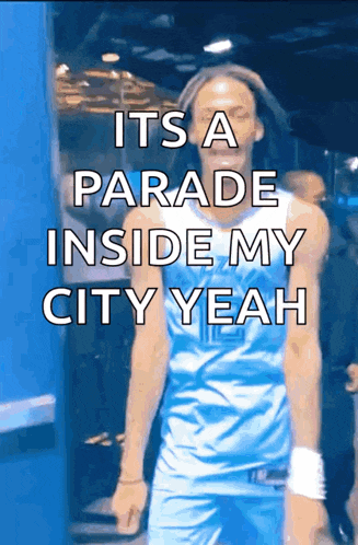 a man in a blue jersey with the words " it 's a parade inside my city yeah "