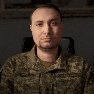 a man in a military uniform has the name budanov on the sleeve