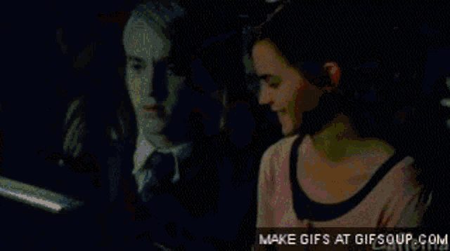 a gif of a man talking on a cell phone with make gifs at gifsoup.com at the bottom
