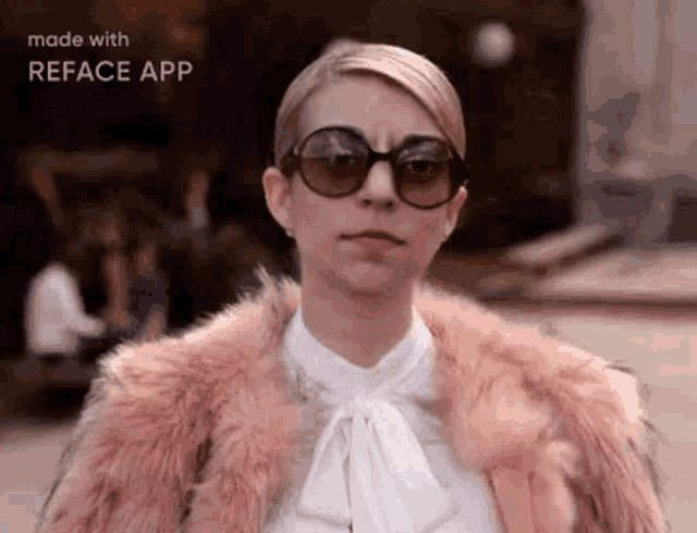 a woman wearing sunglasses and a fur coat is making a funny face .