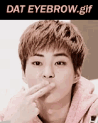 a picture of a young man with the words dat eyebrow .gif above him