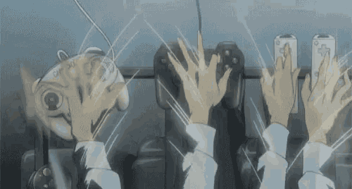 a group of people are playing a video game and their hands are up in the air