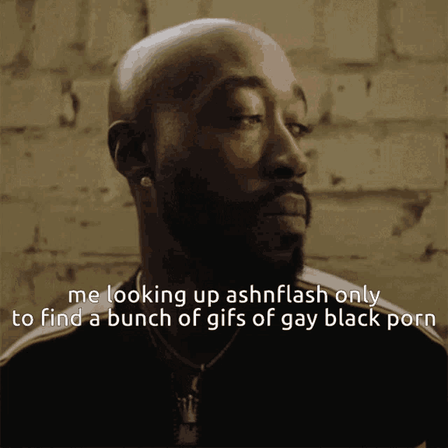 a bald man with a beard is looking up ashnflash only to find a bunch of gay black porn