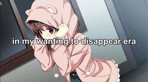 a girl in a pink hoodie with the words in my wanting to disappear era