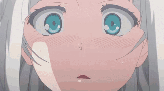 a close up of a girl 's face with hearts in her eyes