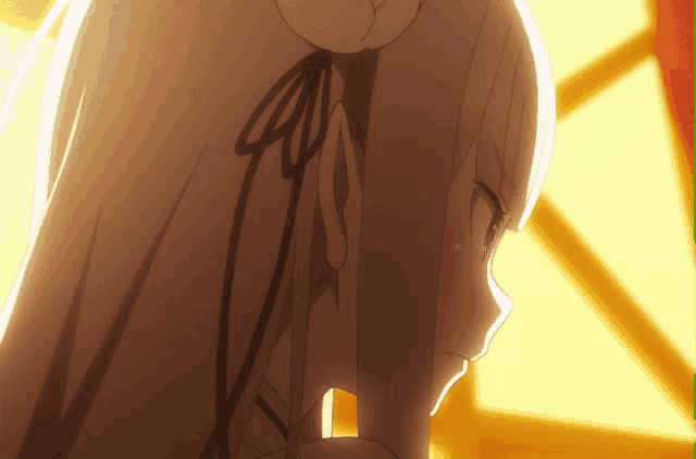 a close up of a girl 's face with a bow in her hair