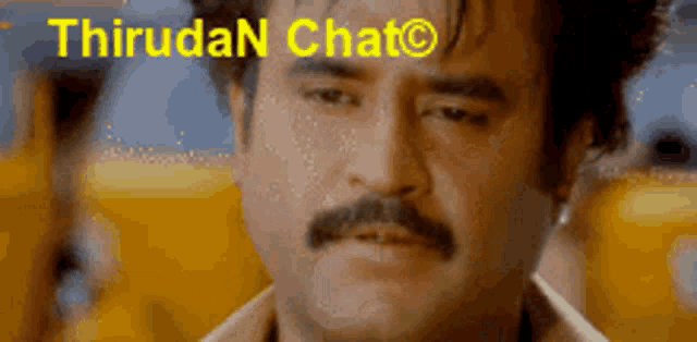 a man with a mustache is looking down with the words thirudan chat behind him