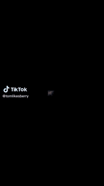 a blurry picture of a man 's face with a tiktok watermark on the bottom .