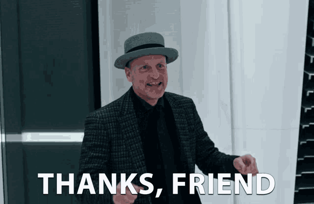a man in a hat says thanks friend
