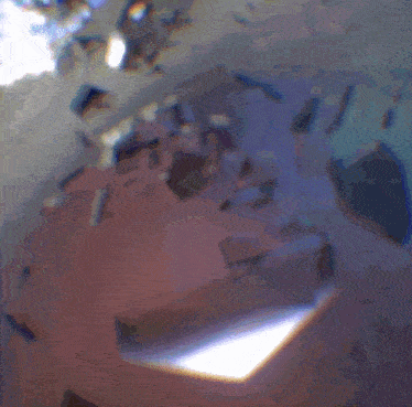 a bunch of pieces of glass are laying on a table