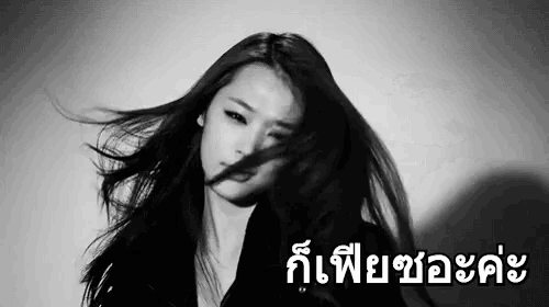 a black and white photo of a woman with foreign writing on the bottom